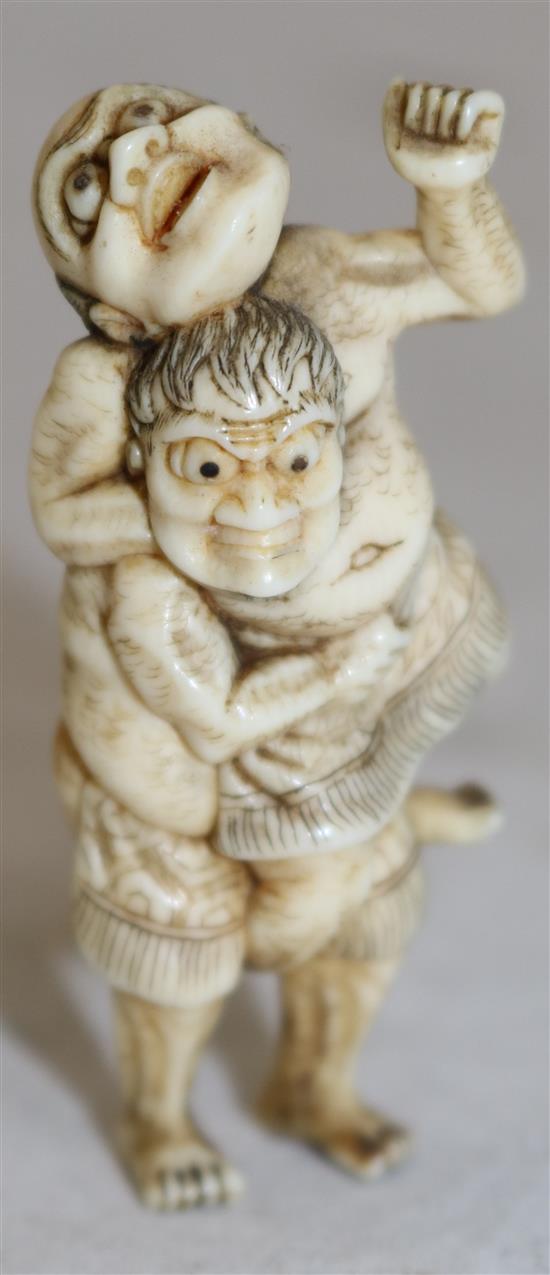 A Japanese ivory netsuke of two sumo wrestlers, 19th century, 5.8cm